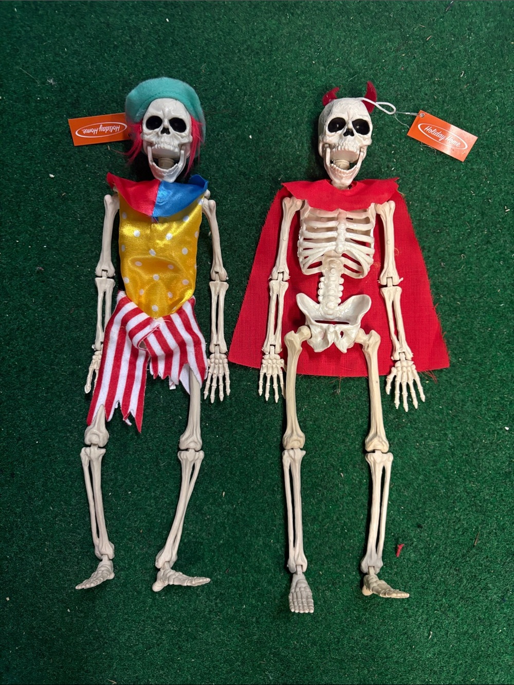 Set of 2 decorative Halloween Skeletons - Red Cape and Multicolor Jester Outfit